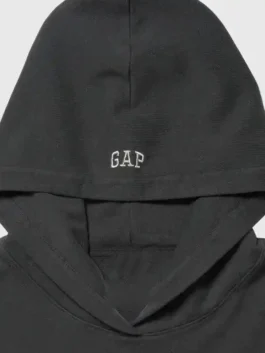 Gap x Katseye Megan Hoodie styled as a black fleece sweatshirt with a hooded collar and Megan's signature minimal and effortless street look.
