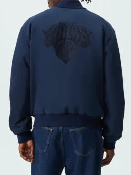 Giorgio Armani Kith New York Knicks Bomber Jacket highlighting professional navy blue grain and luxury waist flap pockets.