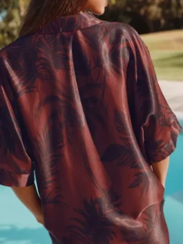 Great Celebrity Bake Off Alison Hammond Palm Print Shirt in vibrant orange polyester with a bold palm print and Alison's joyful on-screen energy.