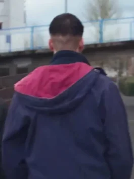 Half Man Mitchell Robertson Hooded Jacket back view in bold blue and red parachute fabric with a clean structured hooded silhouette and sharp character detailing.