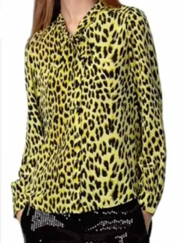 High Potential S02 Morgan Gillory Leopard Shirt as worn by Kaitlin Olson in vibrant yellow leopard print with a fun bow tie collar finish.