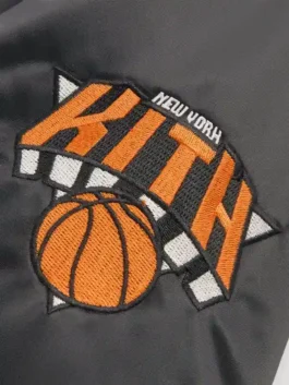 New York Knicks Playoffs Satin Bomber Jacket highlighting professional black grain and luxury full length sleeves.