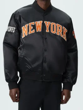 New York Knicks Playoffs Satin Bomber Jacket highlighting professional black finish and luxury side waist pockets.