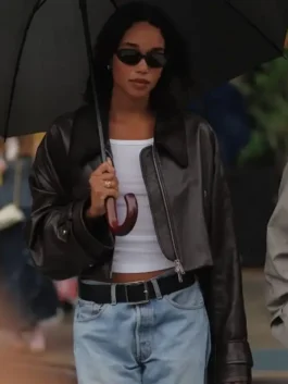 Laura Harrier Brown Cropped Jacket front view in warm brown real leather with a shirt collar, belted cuffs and Laura Harrier's sharp refined cropped silhouette.