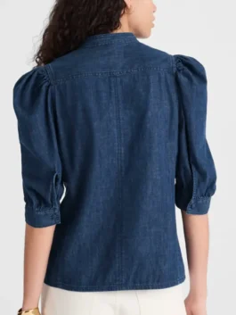 The Comeback S03 Lisa Kudrow Denim Shirt back view highlighting professional fabric grain and luxury button cuffs.
