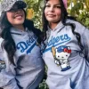 Los Angeles Dodgers Hello Kitty Hoodie featuring a front kangaroo pocket and rib knitted hem.