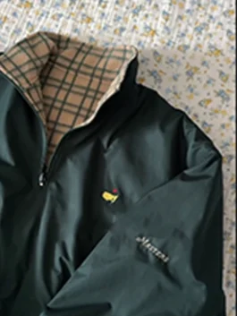 Masters Reversible Jacket featuring professional fabric panels and luxury half zip closure.