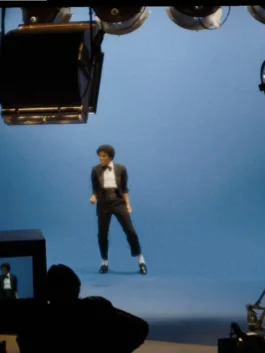 Michael Jaafar Jackson Black Suit highlighting professional fabric grain and luxury buttoned cuffs.