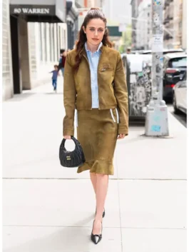 Molly Gordon NYC 2026 Brown Suede Jacket highlighting professional pocket architecture and luxury full length sleeves.