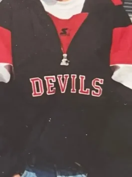 New Jersey Devils Sunny Mehta Starter Jacket in sleek black nylon with bold red and white accents, elastic cuffs and a relaxed hooded everyday pullover silhouette.