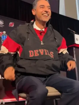 New Jersey Devils Sunny Mehta Starter Jacket in bold black nylon with red and white color block accents and the classic 90s Starter hooded pullover silhouette.