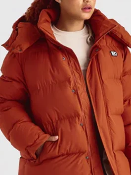 1920 Orange Puffer Jacket as featured on Shark Tank in vibrant orange parachute fabric with a removable hood and a confident everyday puffer build.