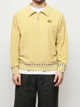 Saturday Night Live S51 Marcello Hernandez Yellow Sweater front view in vibrant yellow with a shirt style collar, half zip closure and rib knitted cuffs.