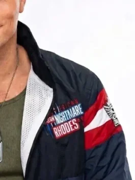 Street Fighter 2026 Cody Rhodes Parachute Jacket as Guile in bold navy and black parachute fabric with a stand up collar and sharp zip-up silhouette.