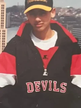 New Jersey Devils Sunny Mehta Starter Jacket as worn by Sunny Mehta in bold black nylon with striking red and white accents and a relaxed hooded pullover fit.