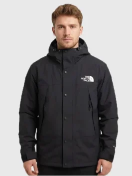 The North Face x Sky High Farm Rain Jacket in professional black polyester with a luxury hooded collar.