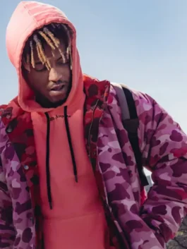 Juice Wrld wearing the Pink Camo Puffer Jacket with casual streetwear outfit and hoodie outdoors