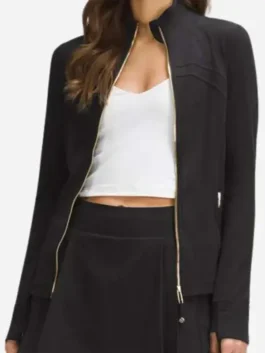 Close-up view of Women’s Define Cropped Black Gold Zipper Jacket sleeve and gold zipper detail