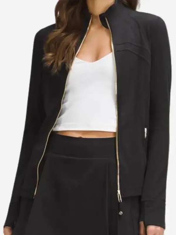 Close-up view of Women’s Define Cropped Black Gold Zipper Jacket sleeve and gold zipper detail