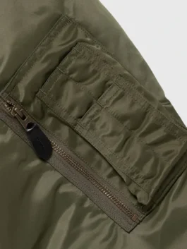 Pokemon x Human Made Satin Bomber Jacket featuring a professional zipper closure and luxury olive finish.