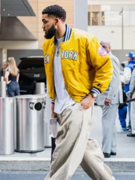 Karl-Anthony Towns New York Knicks Yellow Jacket in yellow satin with viscose lining, rib knitted collar, snap tab button closure and rib knitted cuffs