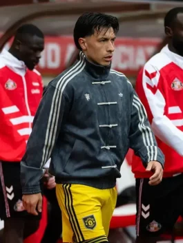Manchester United player in grey Adidas CNY jacket with four knot buttons during Premier League Matchday 36 walkout at Sunderland