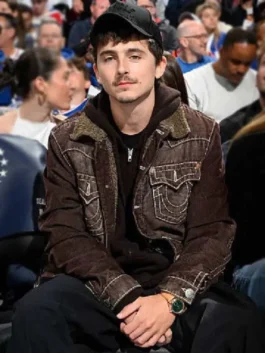 Knicks vs 76ers Timothee Chalamet Trucker Jacket as spotted at Knicks vs 76ers in warm brown corduroy with a sherpa collar and Timothee's bold casual presence.