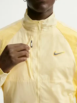 NOCTA Northstar Yellow Track Jacket front view featuring a professional zipper closure and luxury stand up collar.