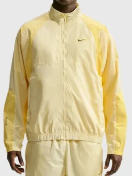 NOCTA Northstar Yellow Track Jacket showcasing professional pocket architecture and luxury elastic cuffs.
