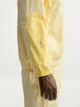 NOCTA Northstar Yellow Track Jacket right view showcasing professional sleeve alignment and luxury finish.