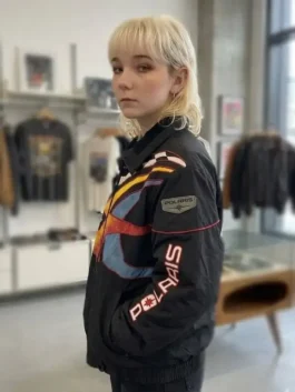 Off Campus Julia Sarah Stone Racing Jacket as Jules Logan in bold black polyester with a shirt collar and a sharp confident Off Campus racing everyday silhouette.