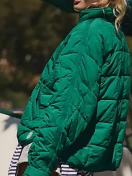 Pippa Packable Dark Green Puffer Jacket side view in rich dark green parachute with a stand up collar and a clean slim packable everyday puffer silhouette.