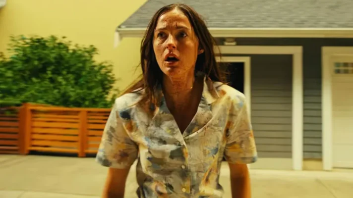Renate Reinsve as Dr. Mary Kline in a damaged stained floral shirt after escaping through the Backrooms in the 2026 A24 horror film