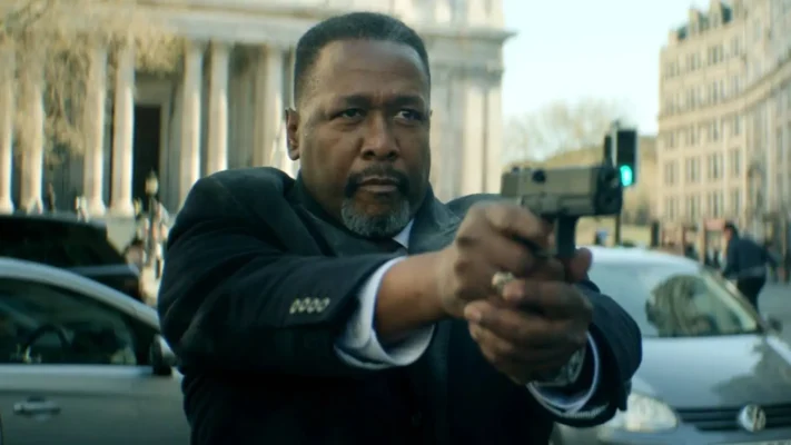 Wendell Pierce aiming his gun in a tense action scene from Tom Clancy’s Jack Ryan Ghost War 2026
