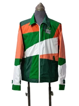 Front view of a multi-colored zip-up windbreaker jacket on a mannequin featuring a geometric color-block pattern in green, orange, and white, with dual chest patches.