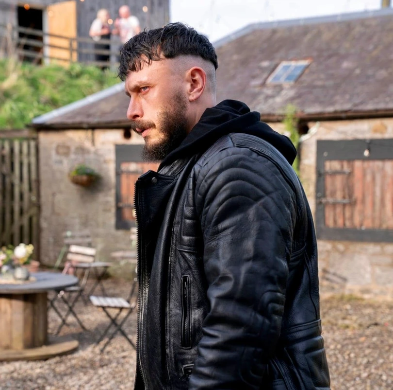 Richard Gadd as Ruben Pallister wearing a black leather jacket over a black hoodie in the HBO drama Half Man 2026