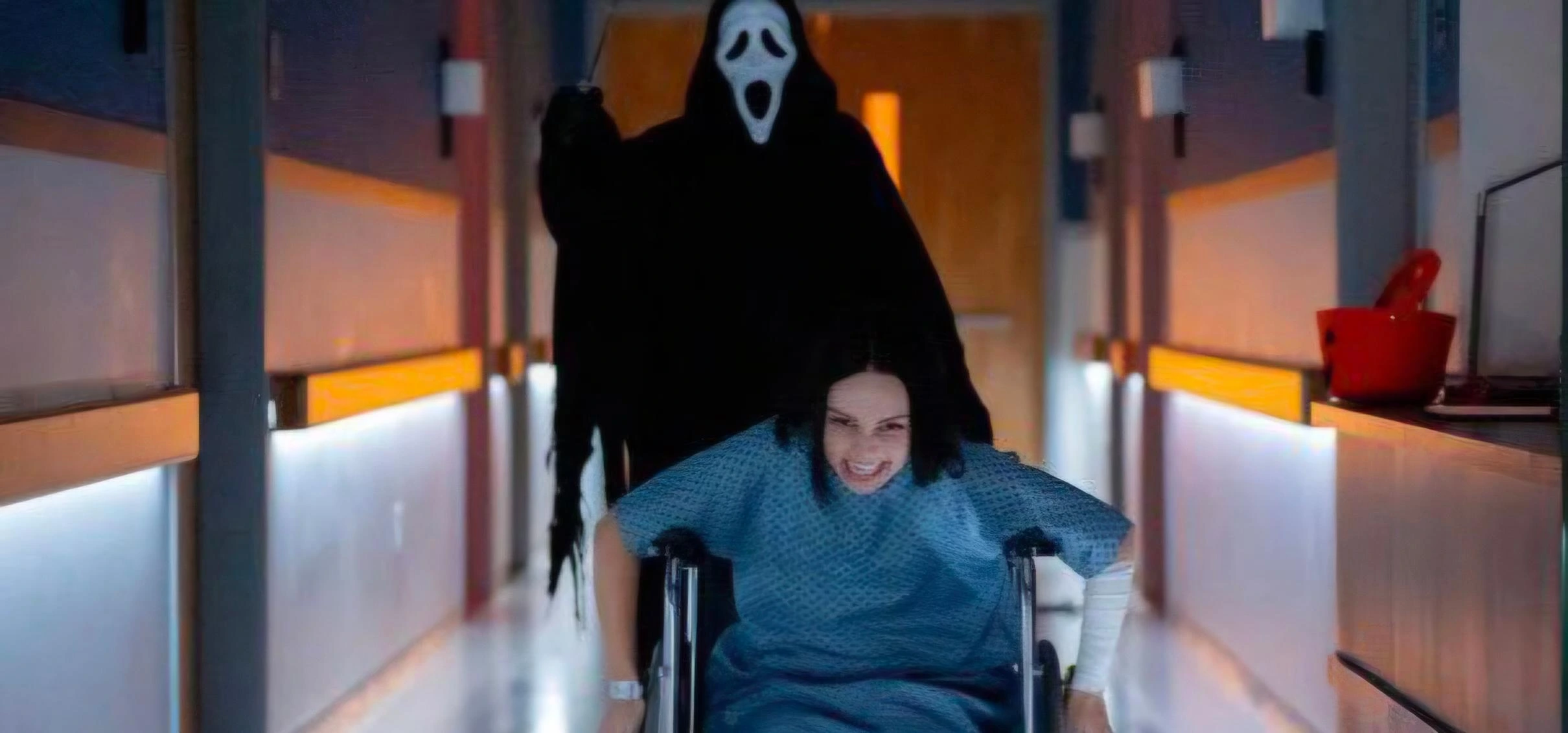 Scary Movie Ghostface in black hooded robe in hospital corridor scene from Scary Movie 6 horror movie 2026