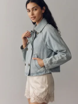 On-body view of blue denim Battle On The Beach Sarah Baeumler Denim Jacket with a neat shirt style collar.