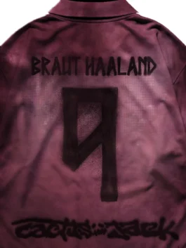 Close up back view of the maroon CJ X Nike Athletes Haaland Retro Jersey showing high-density stitching details.