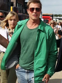 Front view of Brad Pitt wearing an open bright green snap-button jacket over a matching green t-shirt with blue distressed jeans.