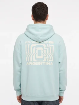 Model wearing the light blue FIFA World Cup 2026 Argentina Hoodie highlighting athletic fit and rib knitted cuffs.