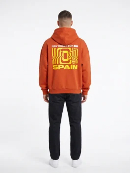 Model view showing the athletic silhouette of the orange fleece FIFA World Cup 2026 Spain Hoodie with rib knitted cuffs.