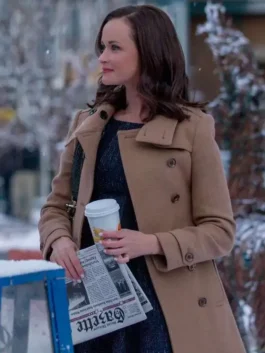 Rory Gilmore holding a newspaper and coffee outdoors in a snowy scene, wearing a double-breasted brown wool trench coat.