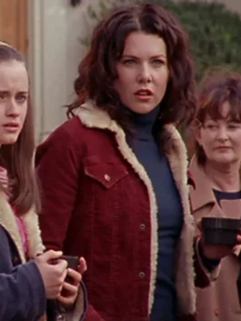 Lauren Graham as Lorelai Gilmore wearing a burgundy corduroy trucker jacket with a cream faux shearling collar and front button closures.