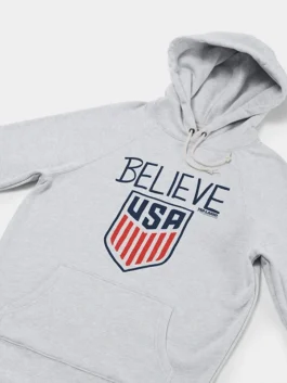 Full look of Homage Ted Lasso Believe x USA Crest Hoodie in grey fleece fabric with comfortable full length sleeves.