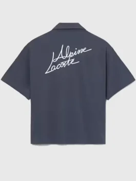 Back view of the dark grey cotton Lacoste x Alpine Poplin Shirt showcasing its premium drape and clean tailoring.
