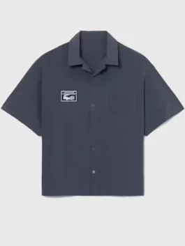 Front view of the Lacoste x Alpine Poplin Shirt highlighting the button closure and functional single chest pocket.
