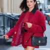 Full view of red cotton Monica Barbaro New York City 2026 Red Jacket highlighting three outside utility pockets.