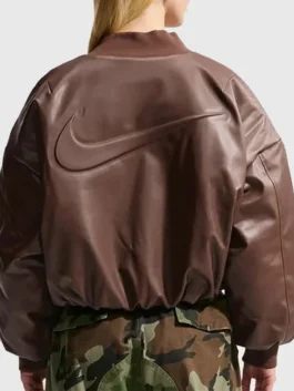 Clean rear look of the brown Nike Womens Therma Fit Bomber Jacket showcasing neat leather stitching.