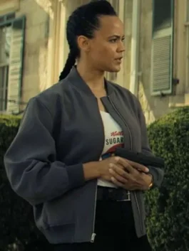 Three-quarter side view of Maria Sten as Frances Neagley wearing the dark grey relaxed-fit bomber jacket with ribbed cuffs and hemline.